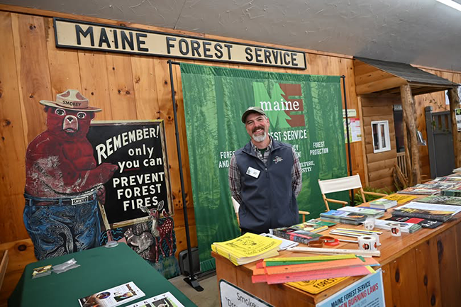 Image of the MFS District Forester Jason Hilton at the the MFS booth at the 2025 Fryeburg Fair.
