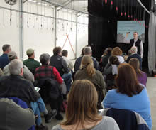 Presenter Showing Materials to Workshop Participants